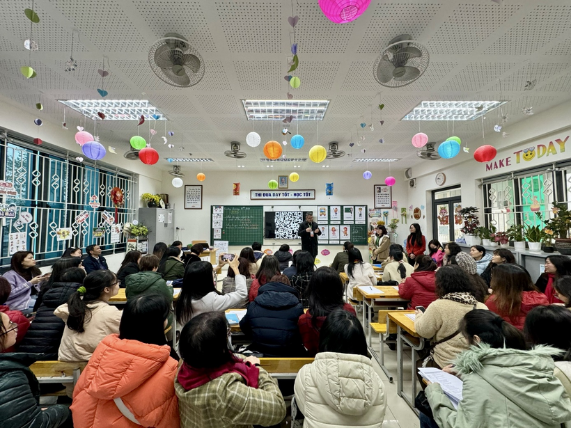 A group of people in a classroomDescription automatically generated
