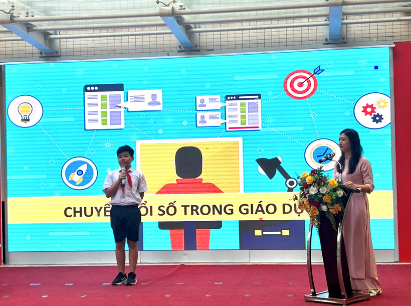 A person and person standing on a stageDescription automatically generated