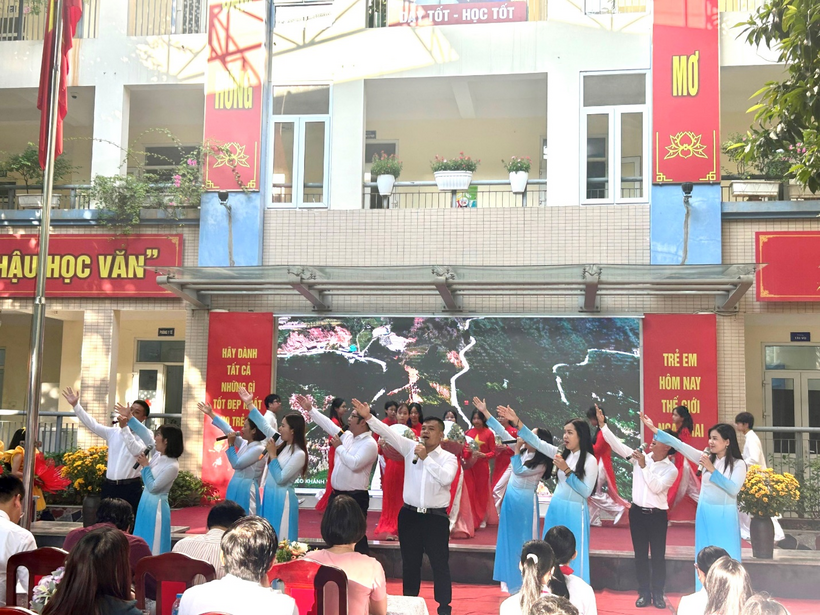 A group of people performing on a stageDescription automatically generated