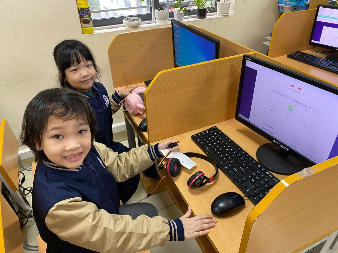 Two children sitting at a computer desk

AI-generated content may be incorrect.