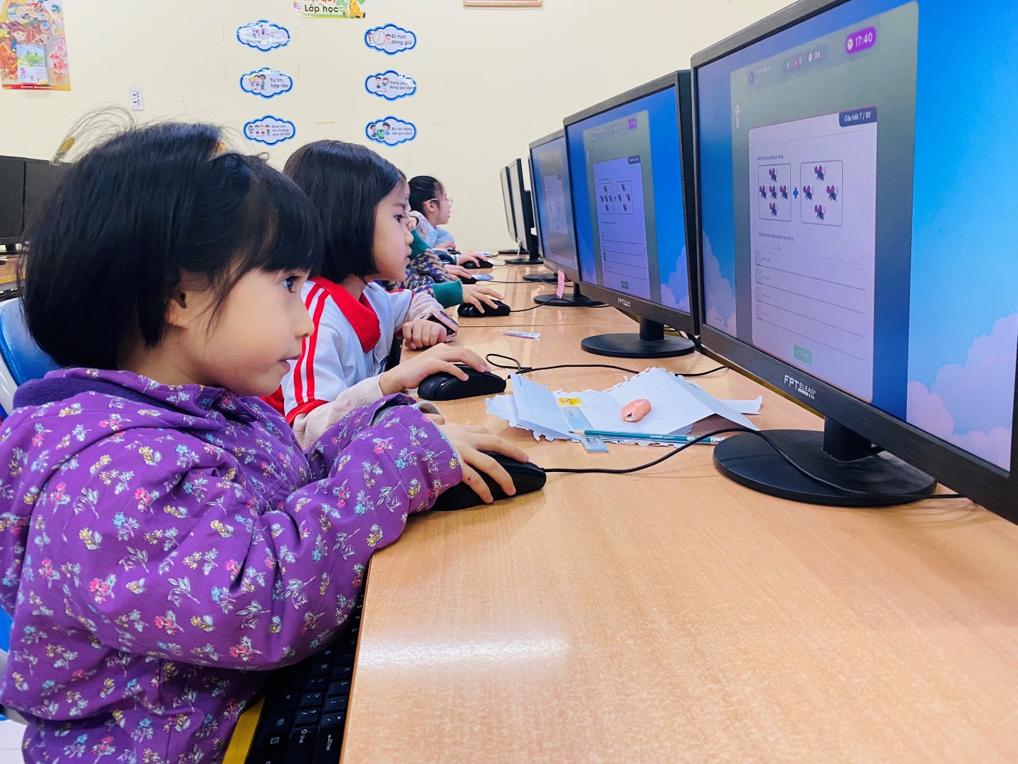 A group of children using computers

AI-generated content may be incorrect.
